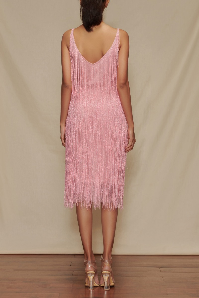 Pink fringe accented dress designed by ...